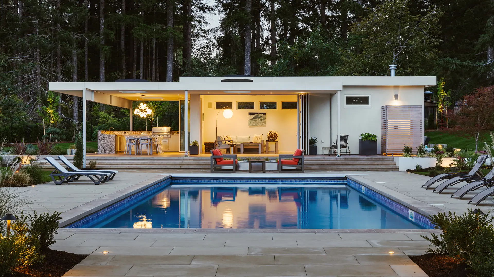 Modern pool house with pool Infront designed in the Comox Valley